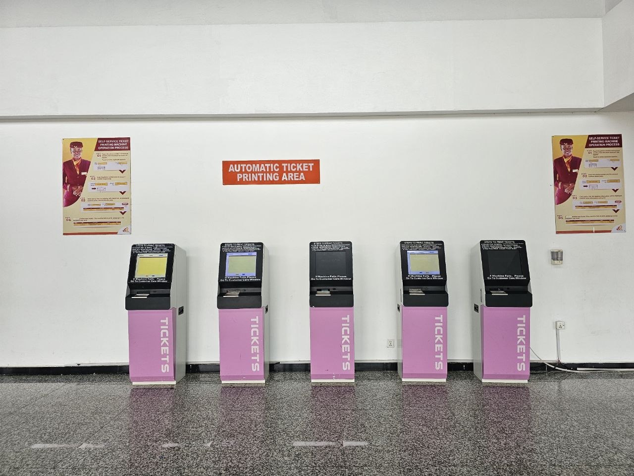 Self-service ticket machines inside the SGR station